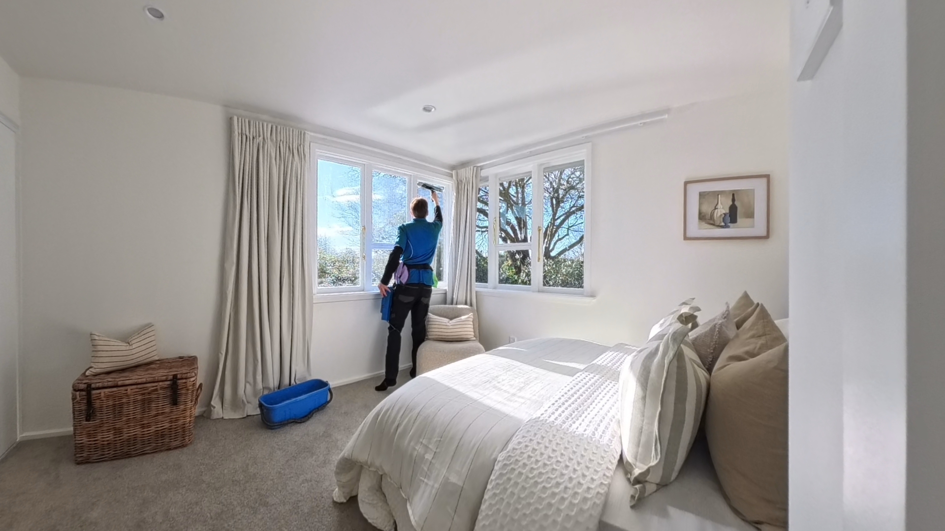 Image of back cleaning window in home